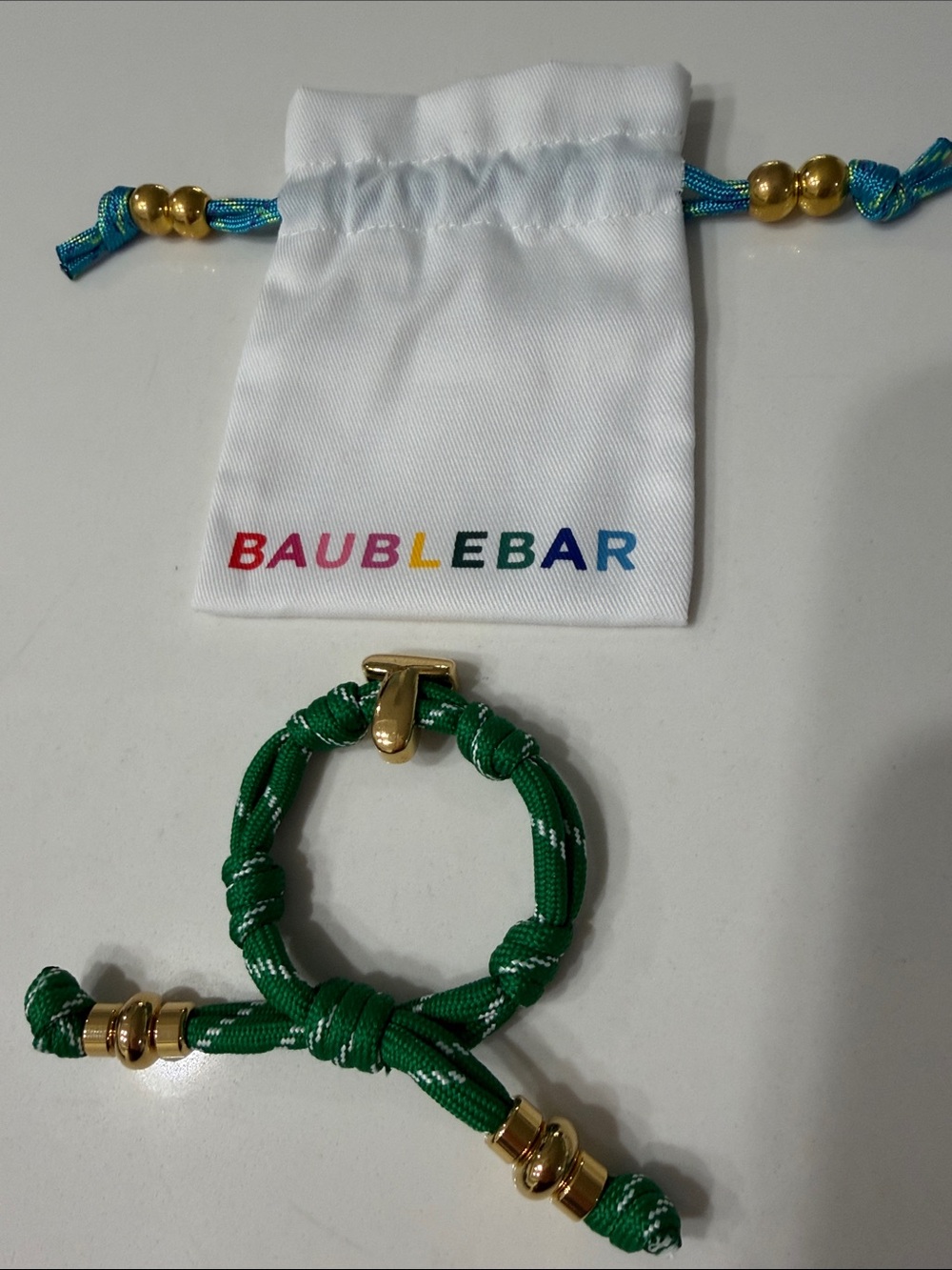 BaubleBar Knotty Initial Bracelet in Green with the initial "T"